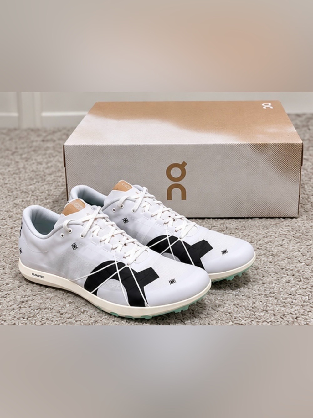 On Running Men's White Athletic Shoes with Black Logo and Tan Accents